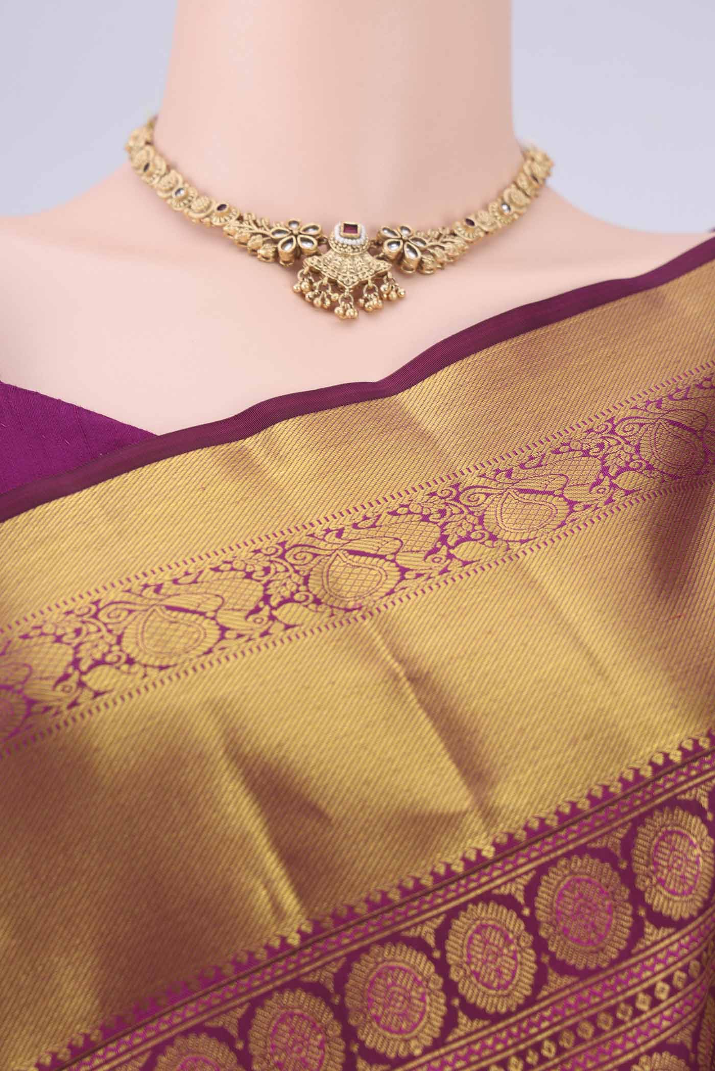 Border image of Burgundy Kanjivaram Silk Saree with Zari Brocade on the body and Zari Border. 