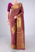 Burgundy Kanjivaram Silk Saree with Zari Brocade on the body and Zari Border.  displayed on a mannequin