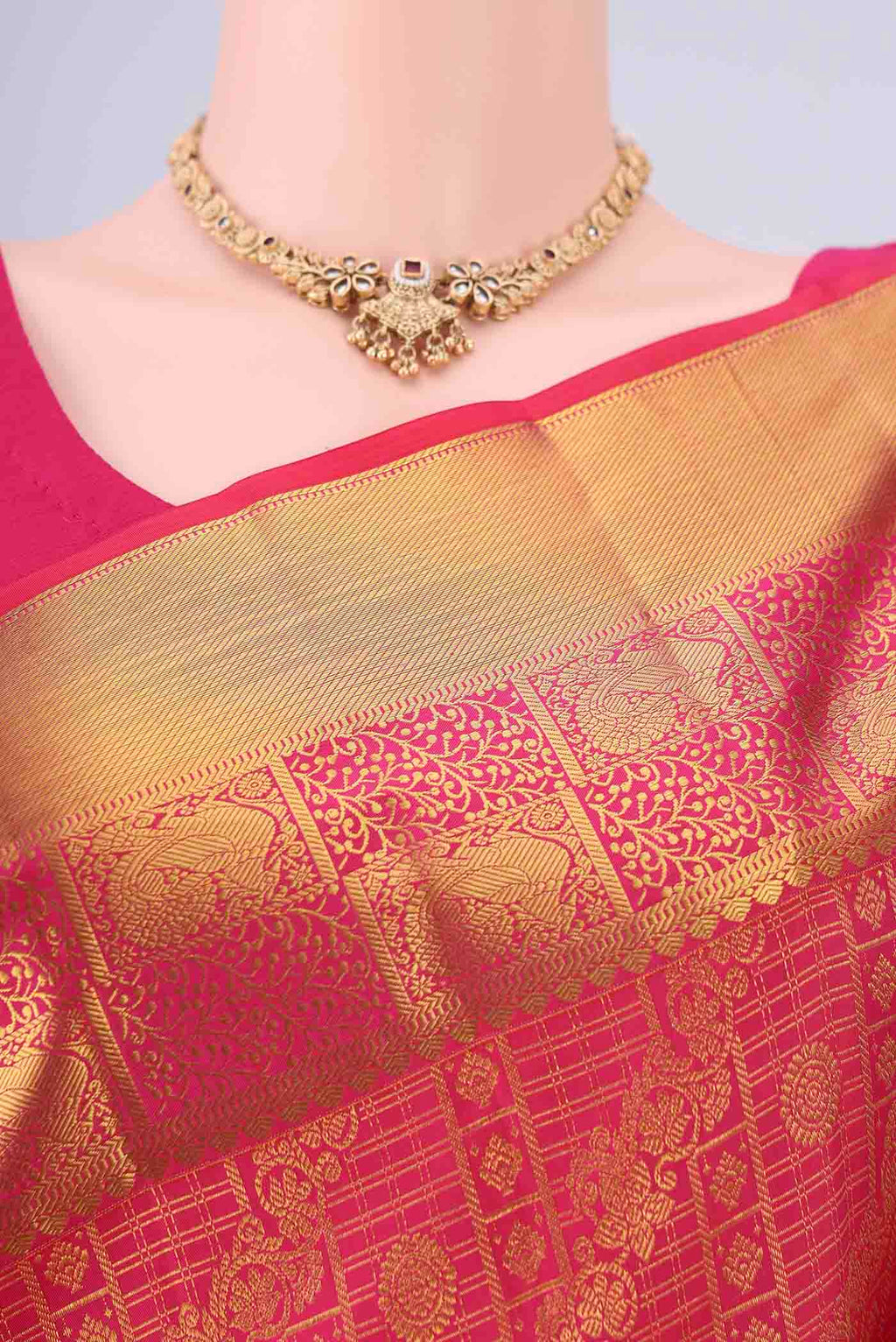 Border image of Rani Pink Kanjivaram Silk Saree with Zari Brocade on the body and Zari Border. 
