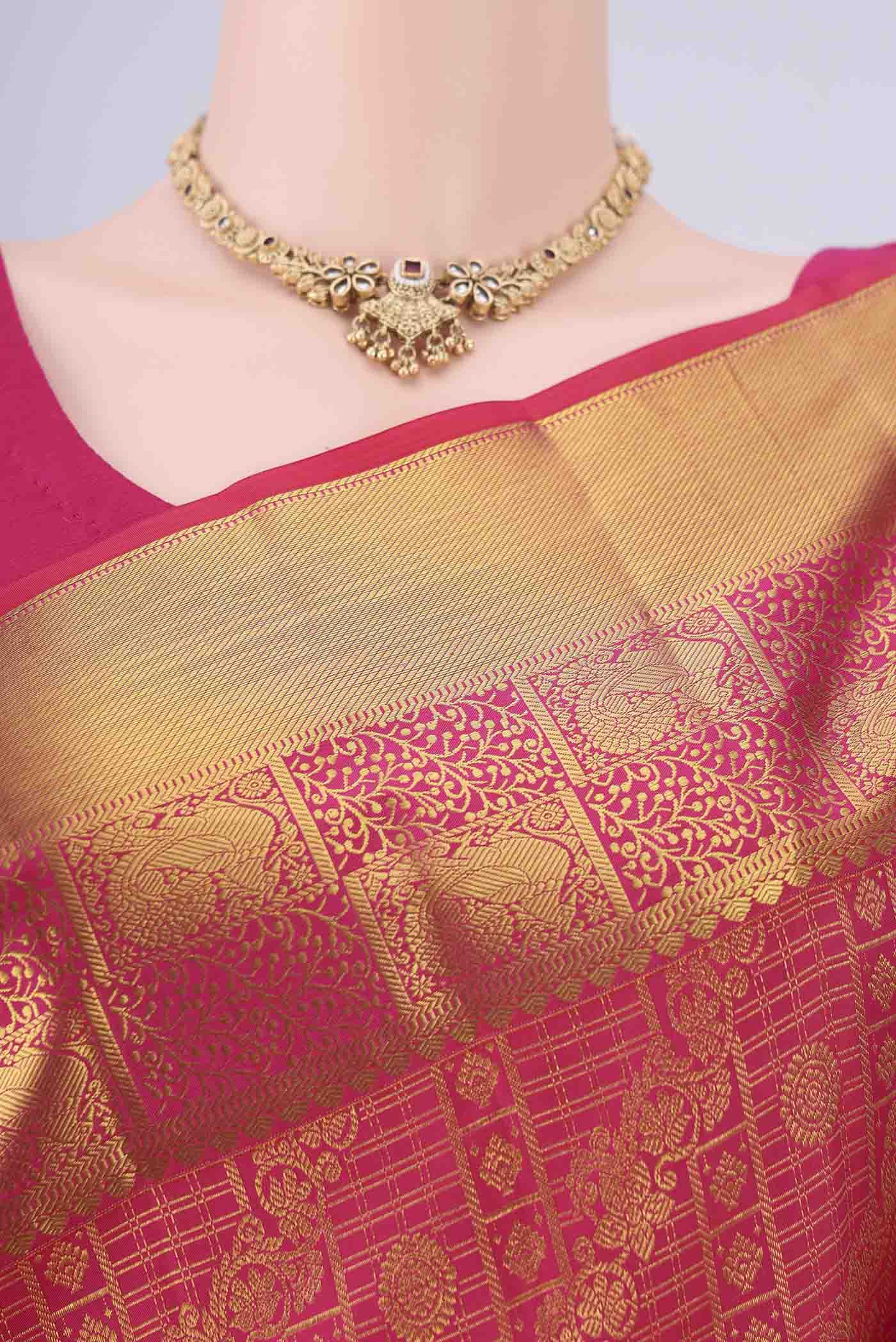 Border image of Rani Pink Kanjivaram Silk Saree with Zari Brocade on the body and Zari Border. 