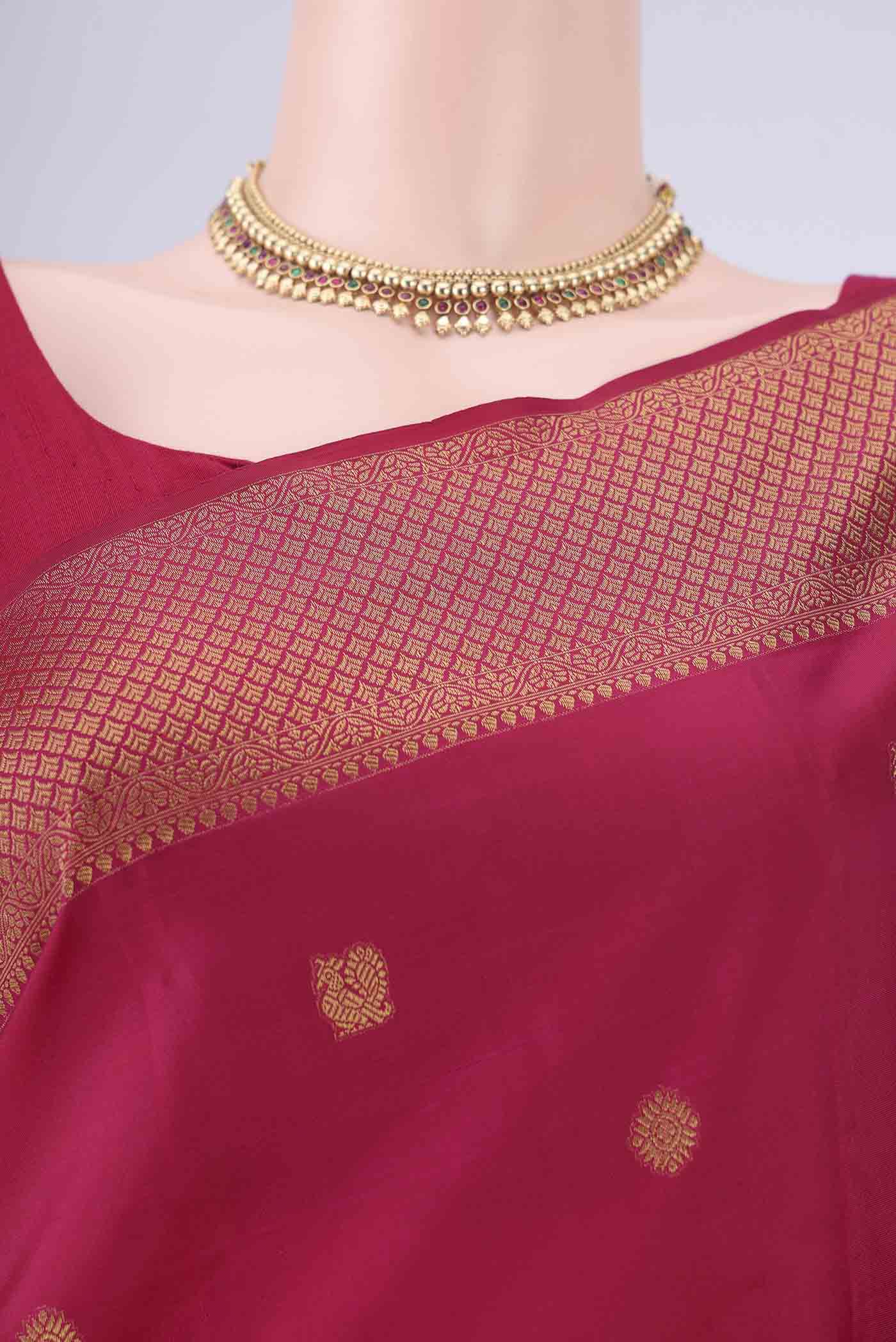 Border image of Maroon Kanchipuram Silk Saree with Zari Butta on the body and Zari Border. 