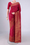 Maroon Kanchipuram Silk Saree with Zari Butta on the body and Zari Border.  displayed on a mannequin