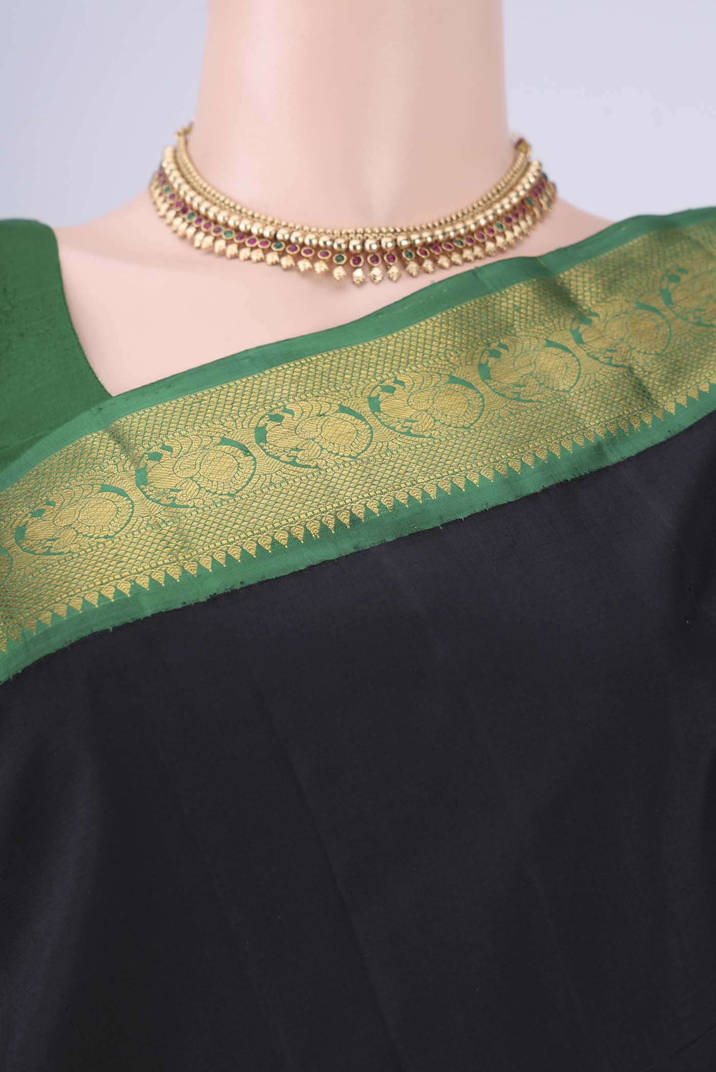 Border image of Black Dual Tone Kanjivaram Silk Saree with Plain Body and Zari Border. 