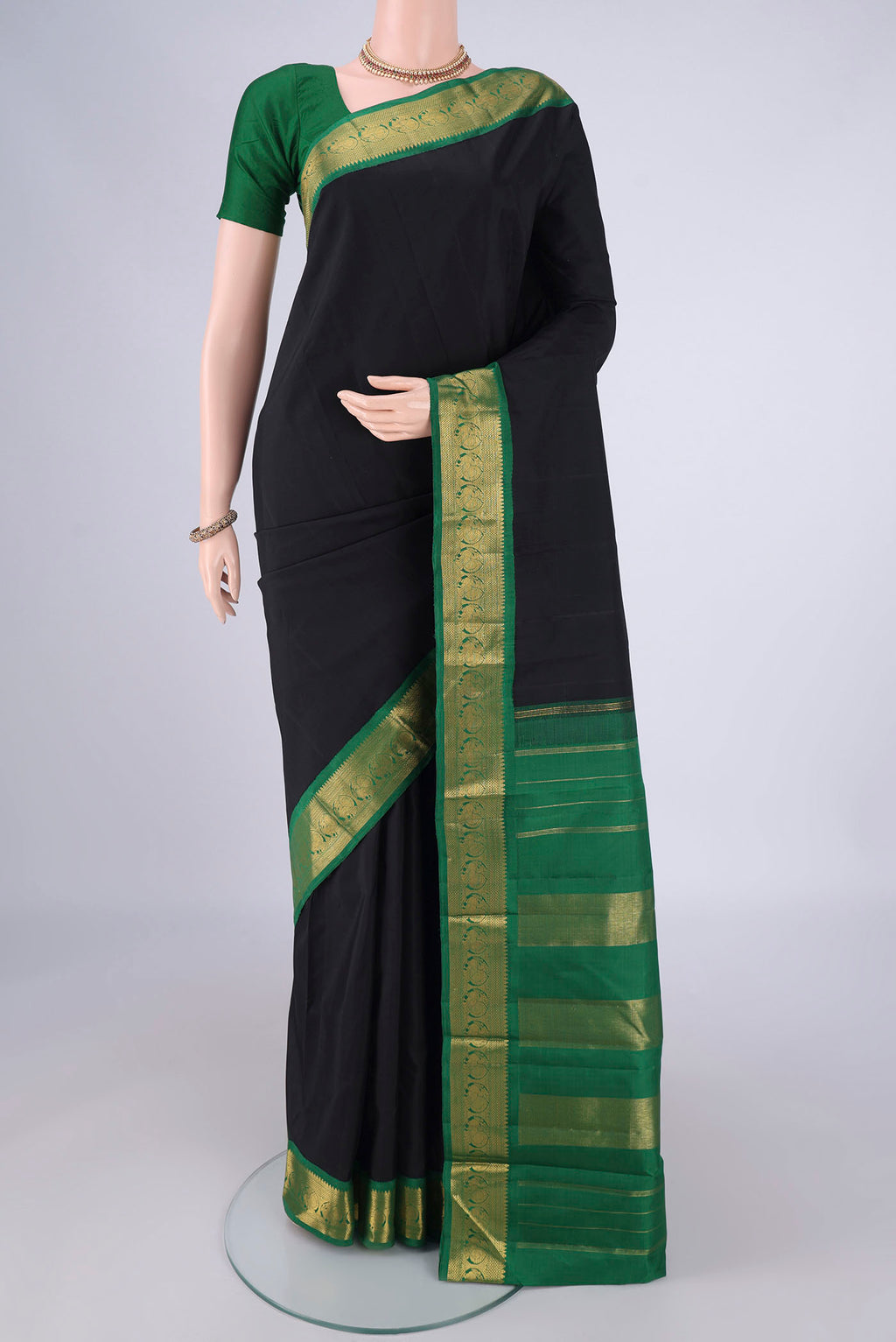 Black Dual Tone Kanjivaram Silk Saree with Plain Body and Zari Border.  displayed on a mannequin