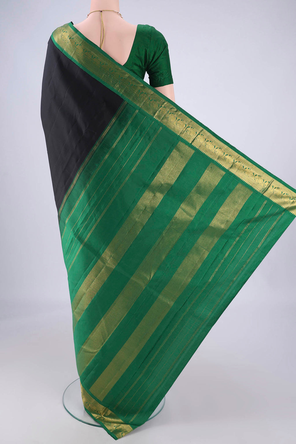 Flat view of Black Dual Tone Kanjivaram Silk Saree with Plain Body and Zari Border. 