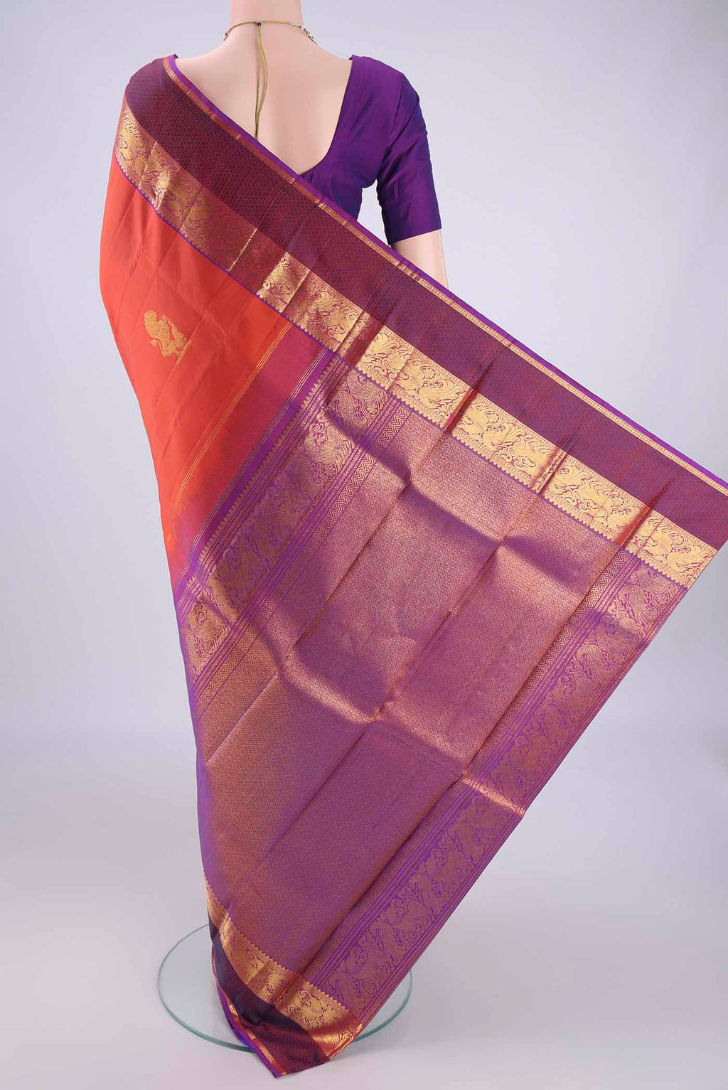 Flat view of Rust Dual Tone Kanjivaram Silk Saree with Zari Butta on the body and Zari Border. 
