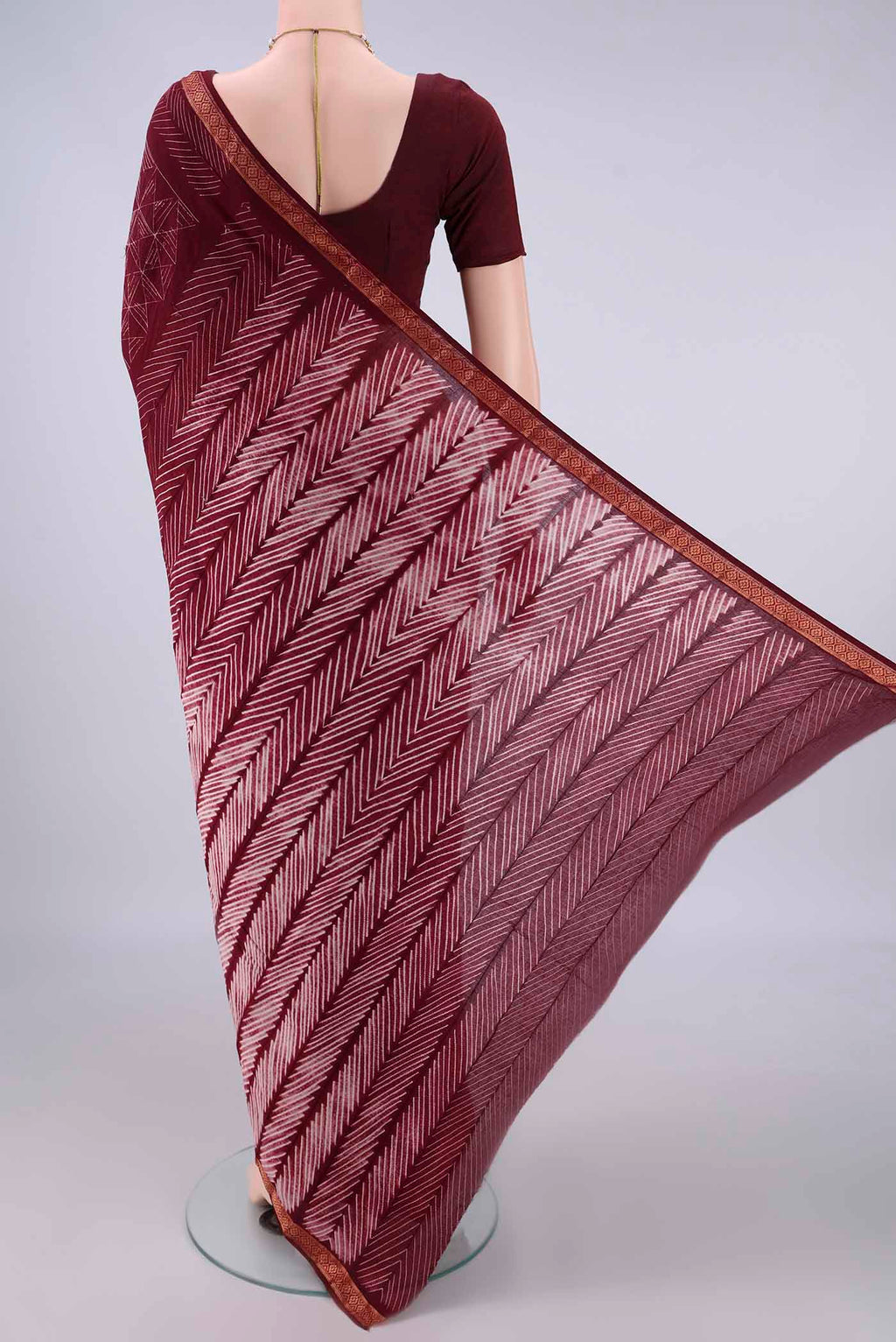 Flat view of Maroon Cotton Saree with Plain Body and Thread Border. 