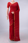 Red Cotton Saree with Printed design on the body and Zari Border.  displayed on a mannequin