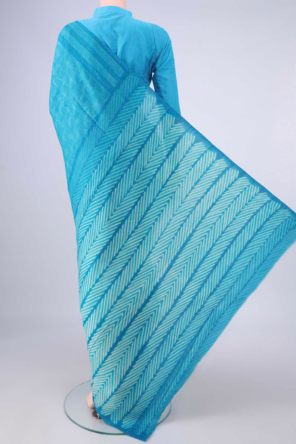 Flat view of Blue Tussar Saree with Printed design on the body and Without Border. 