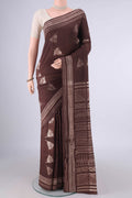Brown Tussar Saree with Printed design on the body and Printed Border.  displayed on a mannequin
