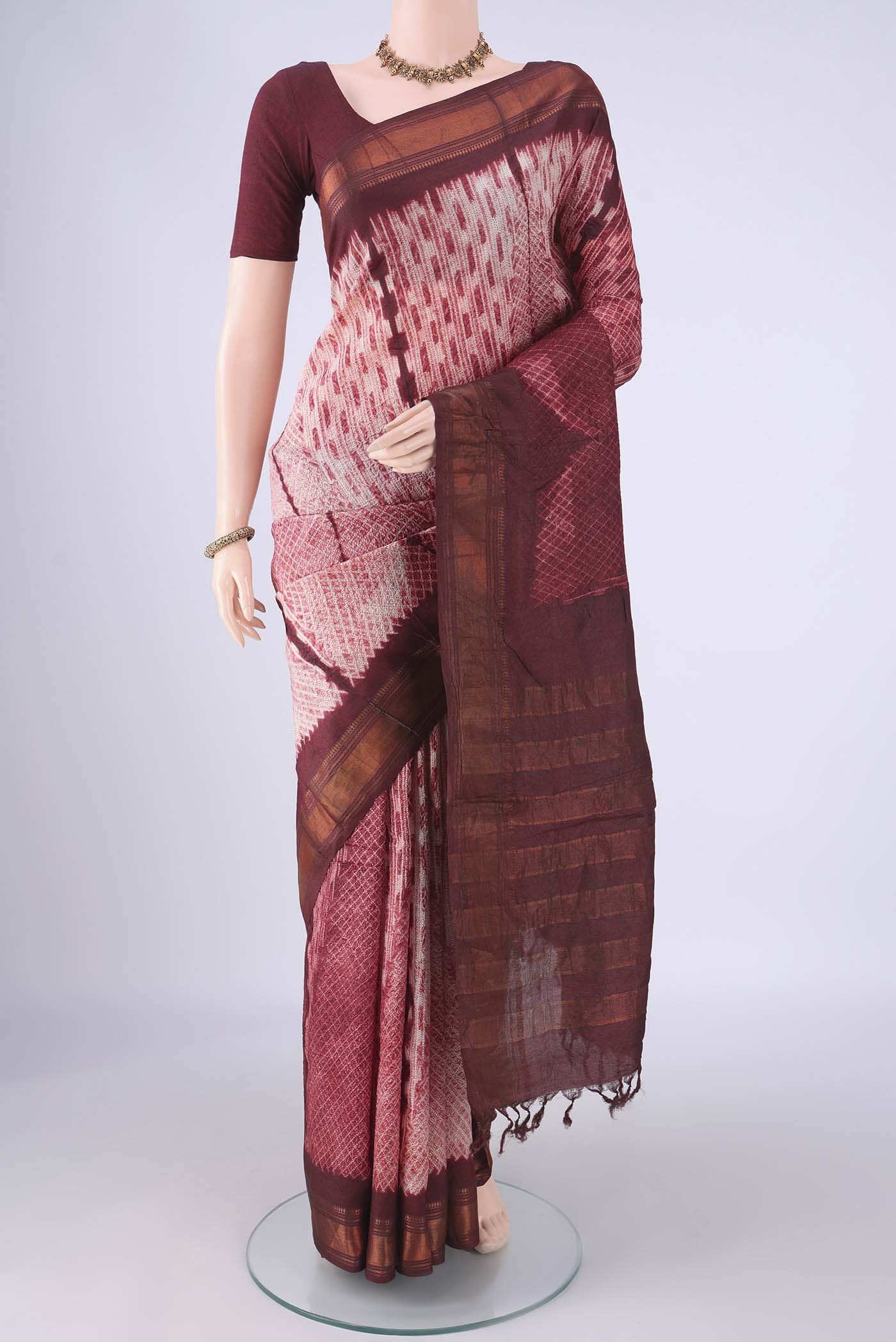 Cream Tussar Silk Saree with Printed design on the body and Zari Border.  displayed on a mannequin