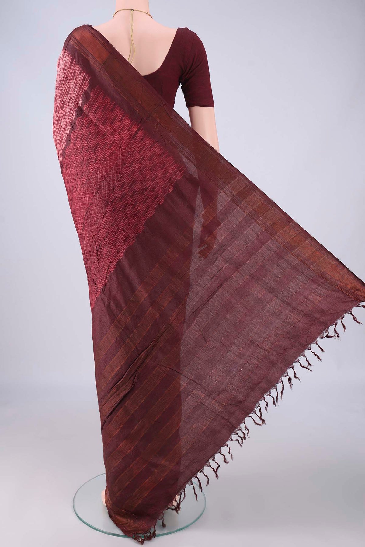 Flat view of Cream Tussar Silk Saree with Printed design on the body and Zari Border. 