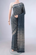 Pure Silk Grey Tussar Saree with Printed design on the body and Without Border.  displayed on a mannequin