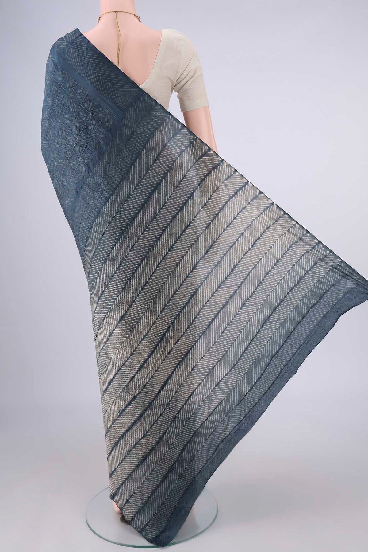 Flat view of Pure Silk Grey Tussar Saree with Printed design on the body and Without Border. 