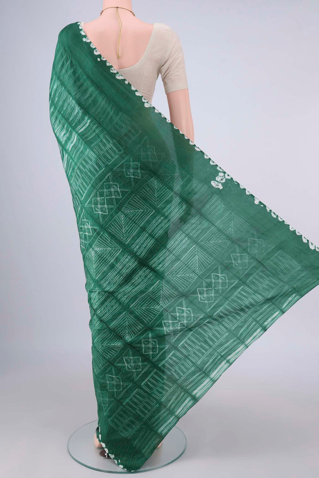 Flat view of Pure Silk Green Printed Saree with Printed design on the body and Printed Border. 