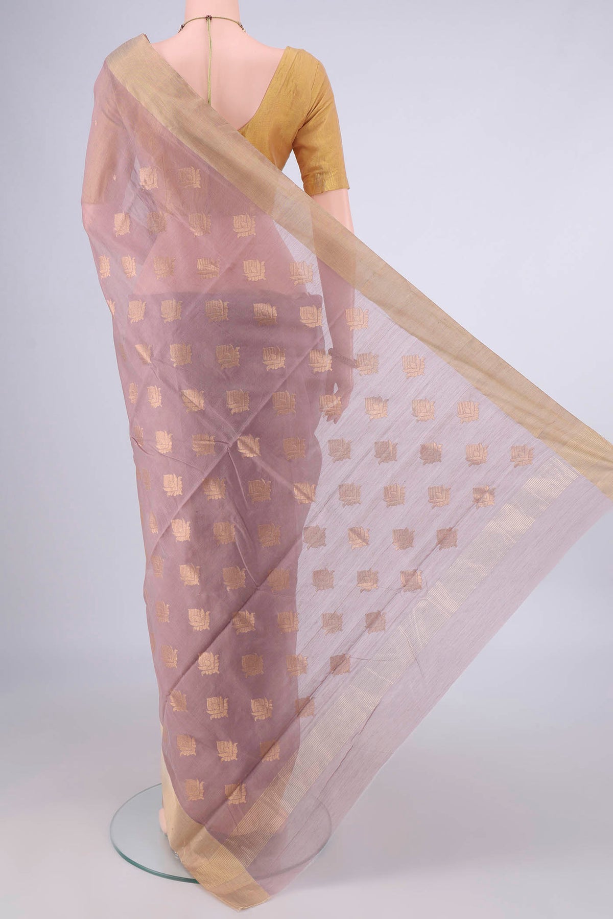 Flat view of Beige Chanderi Cotton Saree with Zari Butta on the body and Zari Border. 