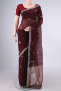 Maroon Chanderi Cotton Saree with Zari Butta on the body and Zari Border.  displayed on a mannequin