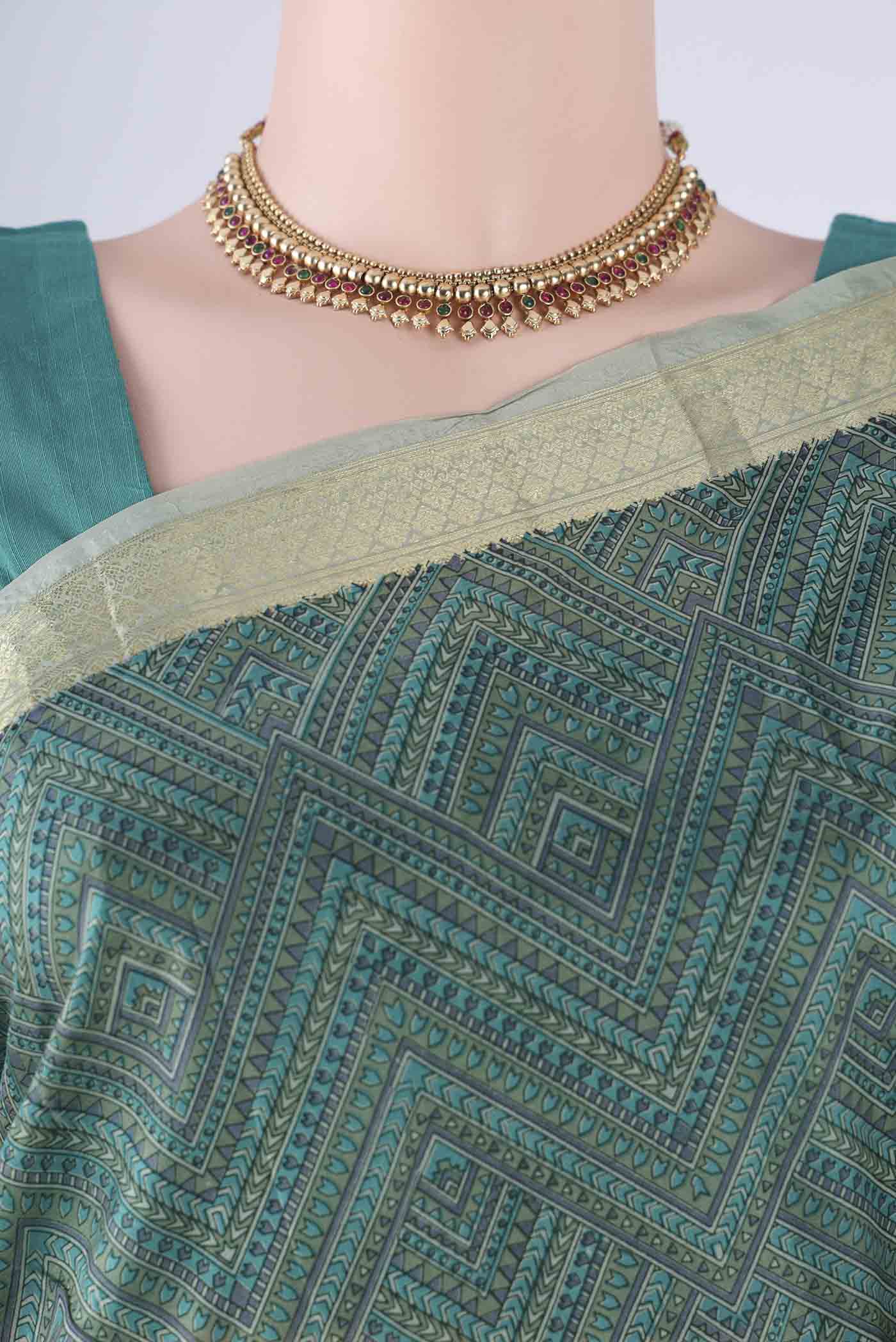 Border image of Sage Green Printed Silk Saree with Printed design on the body and Zari Border. 