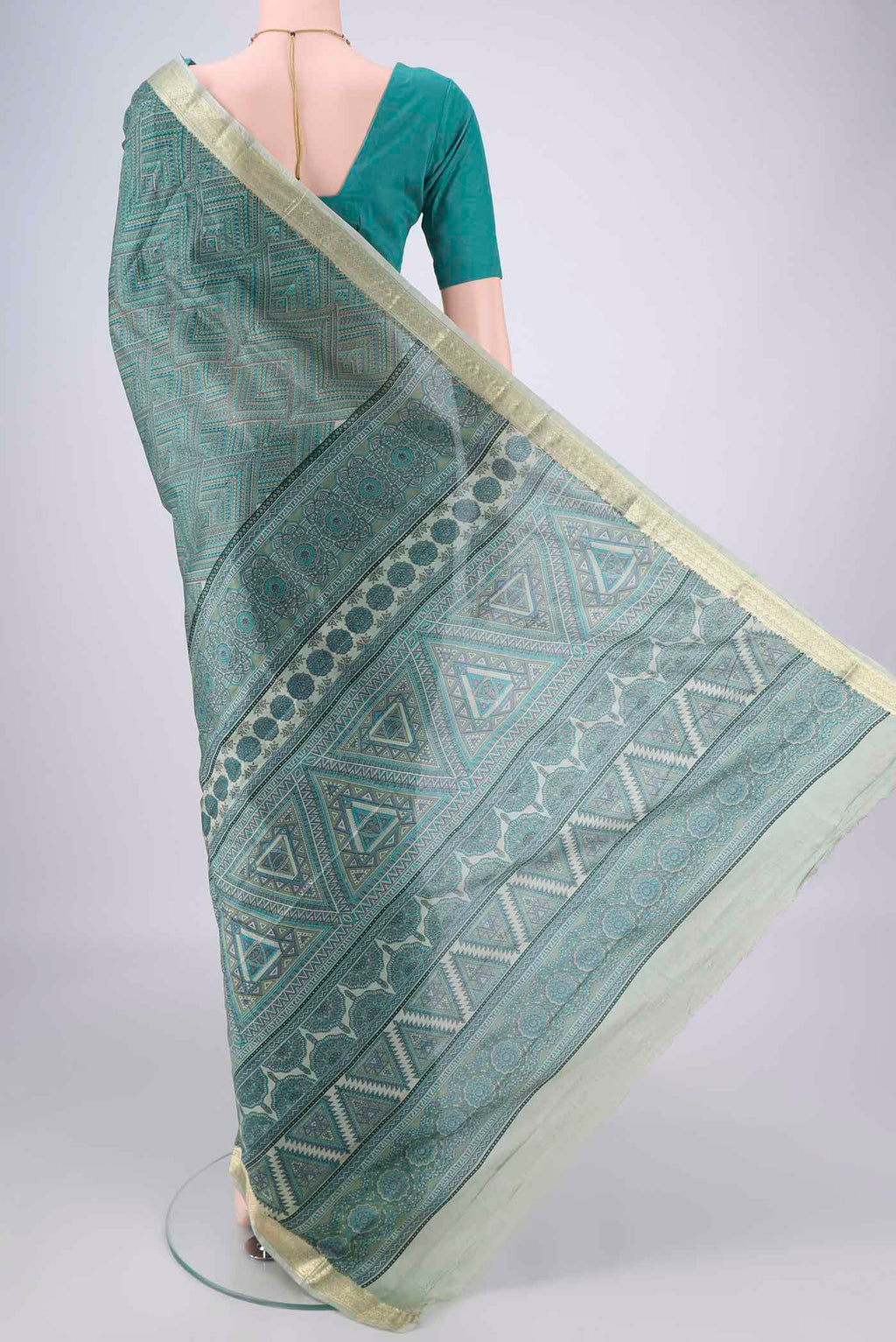 Flat view of Sage Green Printed Silk Saree with Printed design on the body and Zari Border. 