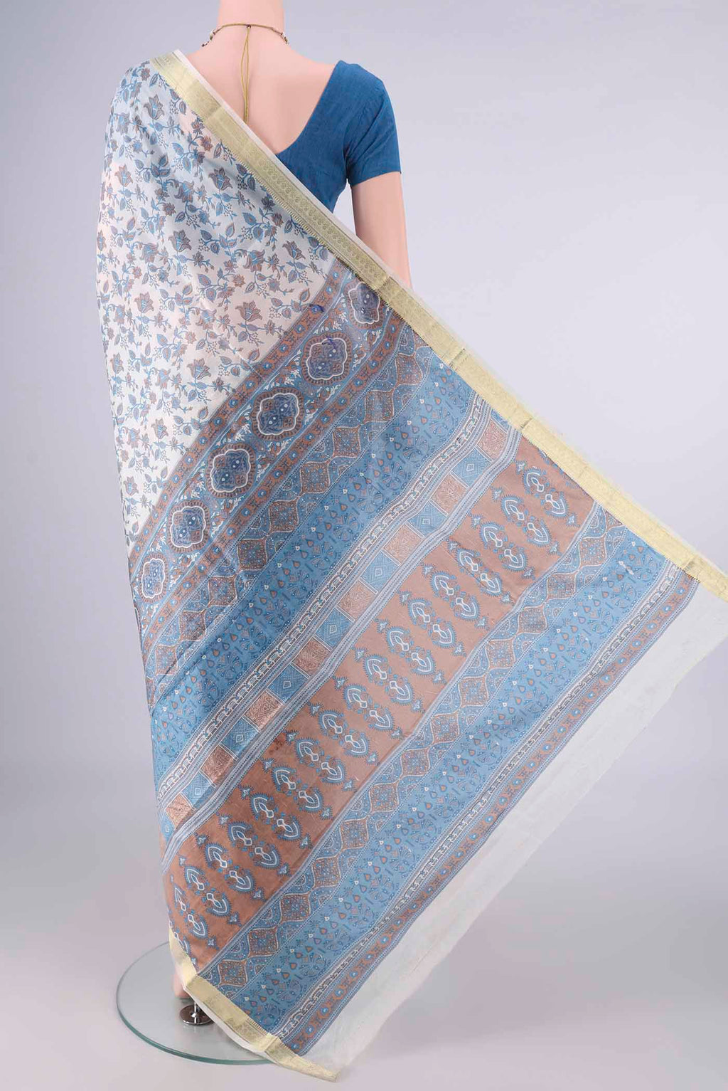 Flat view of Pure Silk Off White Printed Saree with Printed design on the body and Zari Border. 
