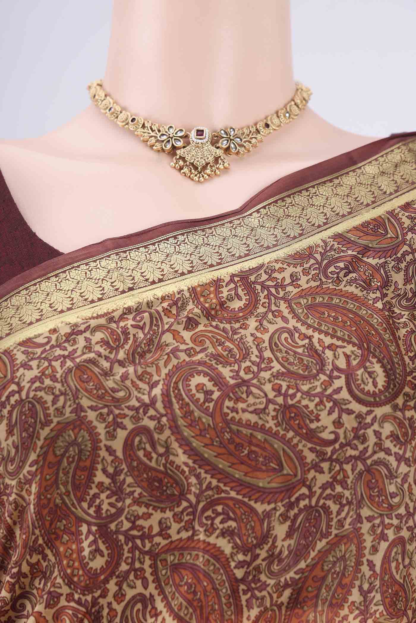 Border image of Sandal Printed Silk Saree with Printed design on the body and Zari Border. 