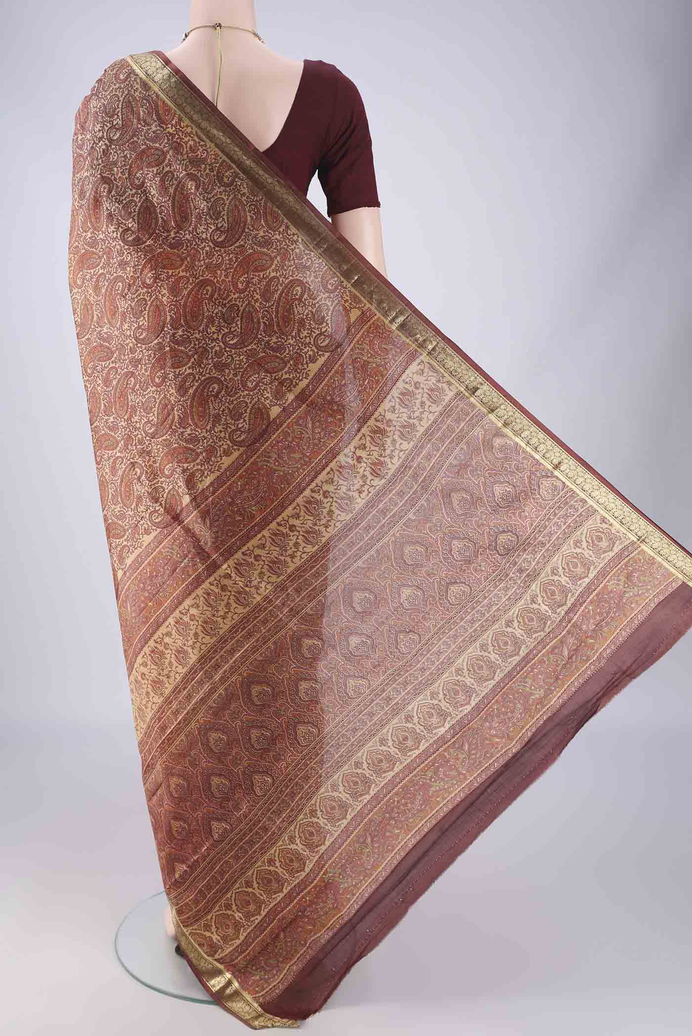 Flat view of Sandal Printed Silk Saree with Printed design on the body and Zari Border. 
