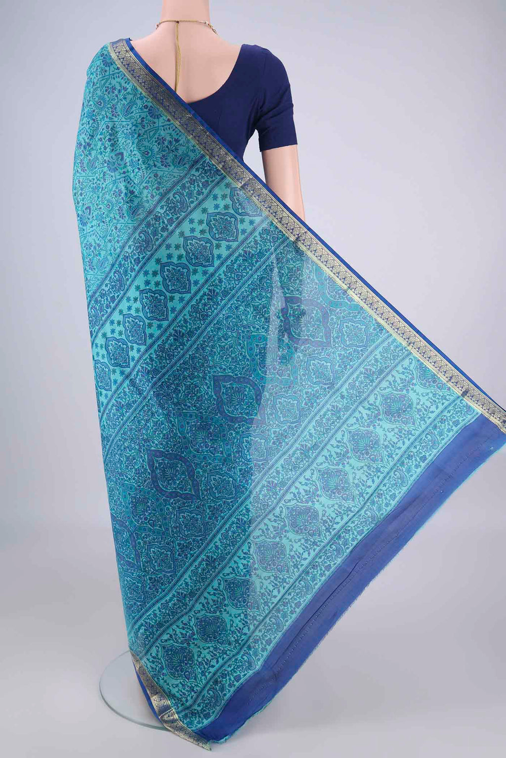 Flat view of Blue Printed Silk Saree with Printed design on the body and Zari Border. 