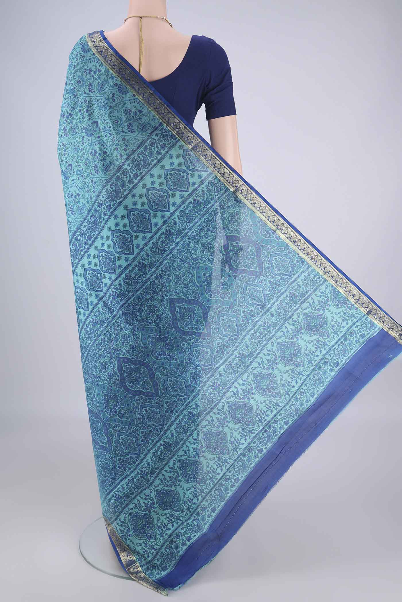 Flat view of Blue Printed Silk Saree with Printed design on the body and Zari Border. 