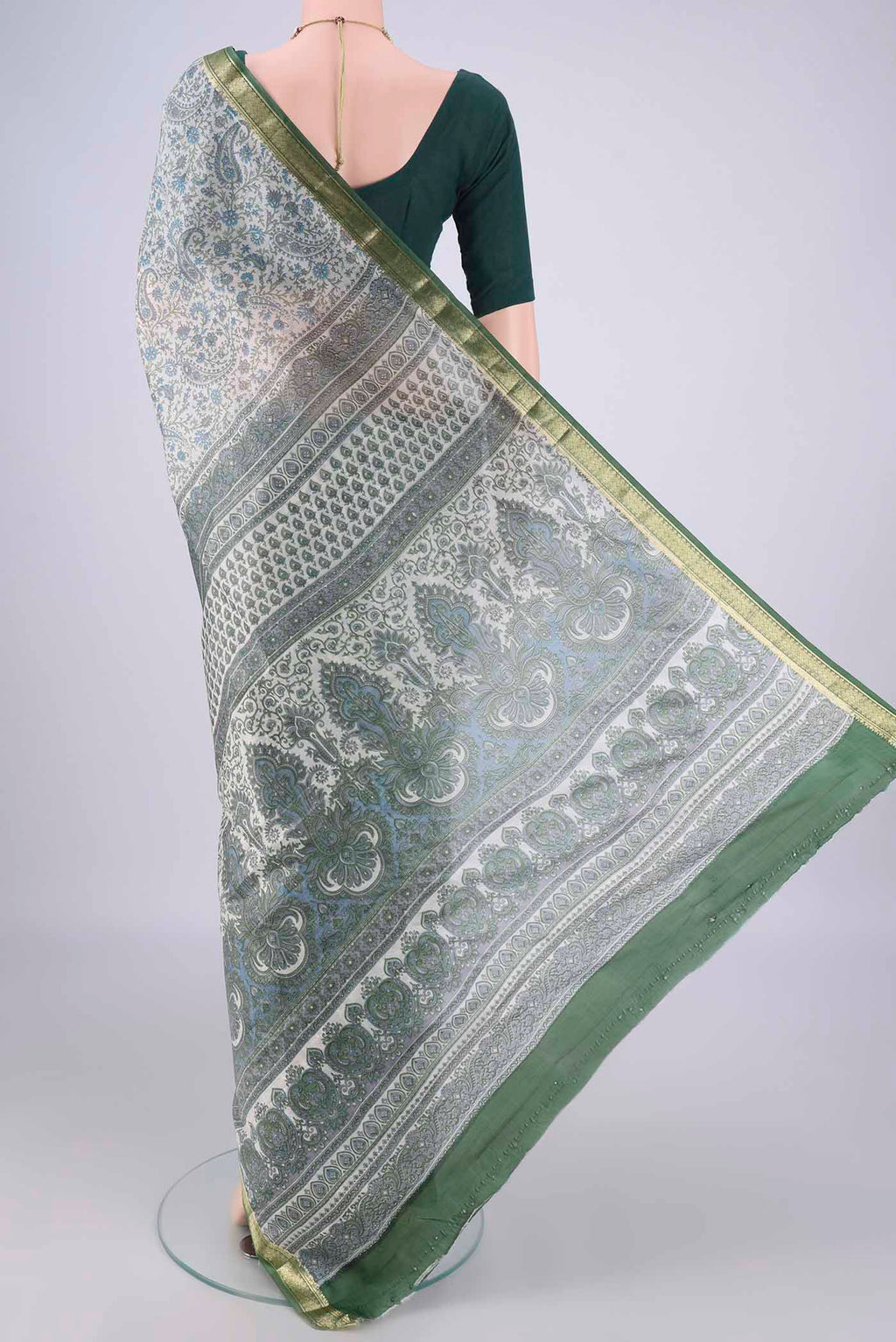 Flat view of Off White Printed Silk Saree with Printed design on the body and Zari Border. 