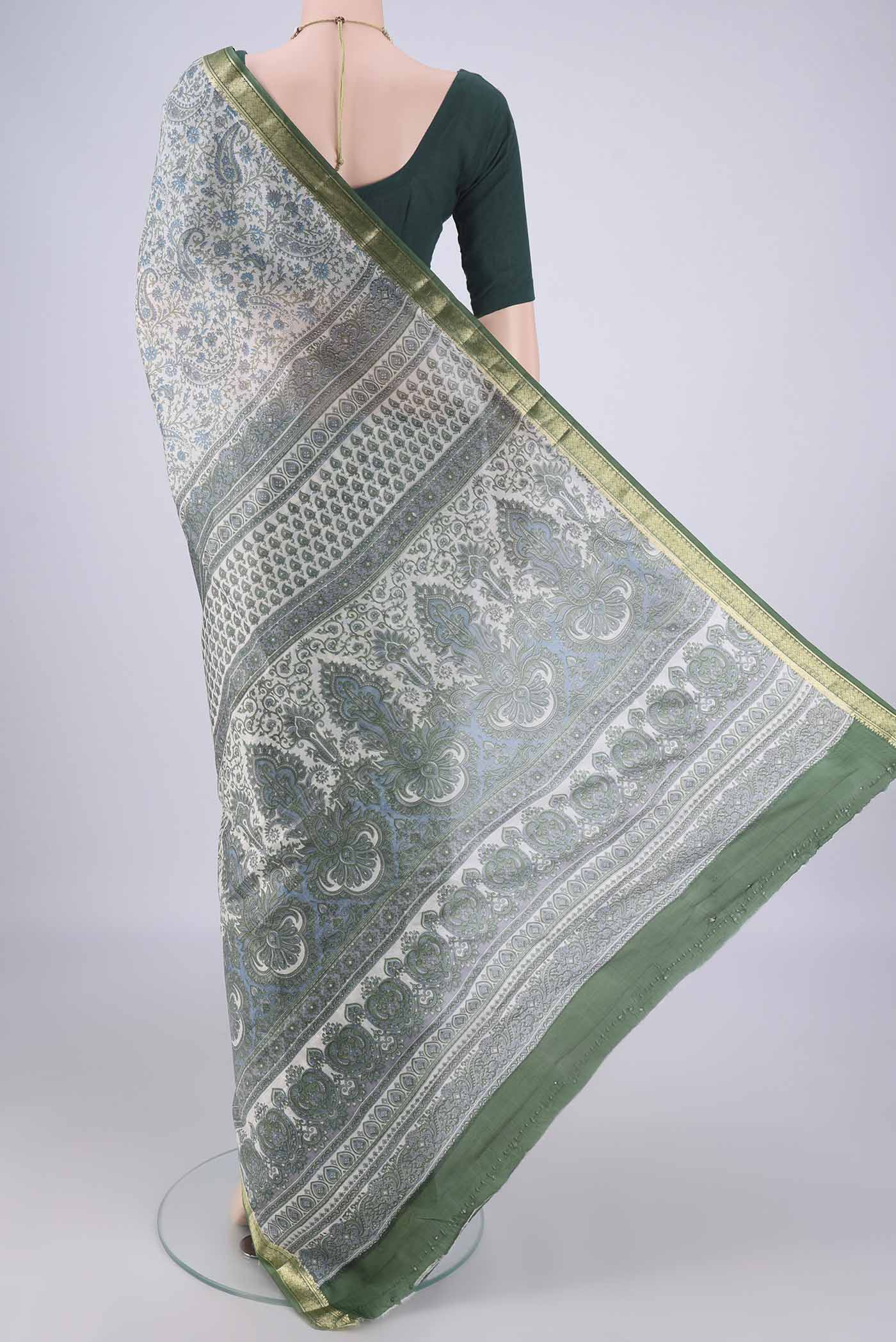 Flat view of Off White Printed Silk Saree with Printed design on the body and Zari Border. 