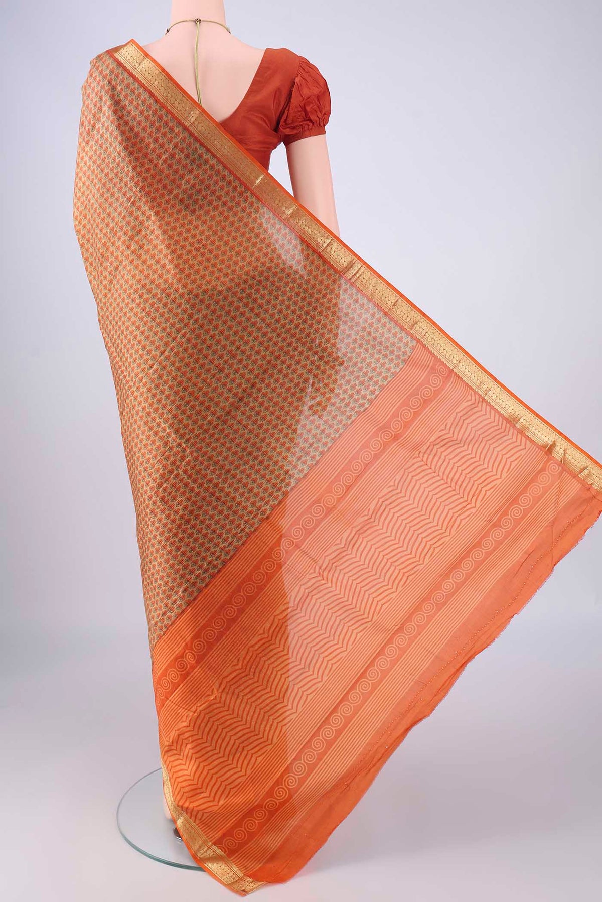 Flat view of Dark Beige Printed Silk Saree with Printed design on the body and Zari Border. 