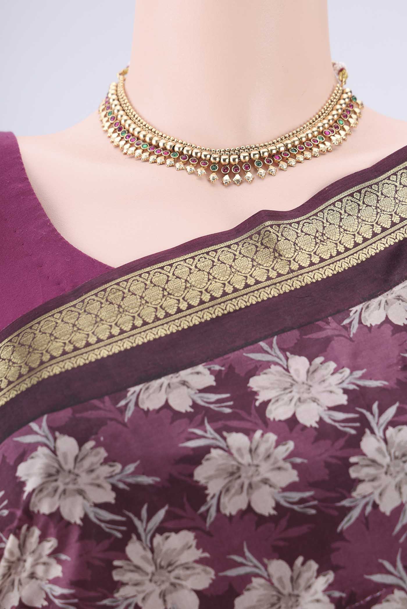 Border image of Burgundy Printed Silk Saree with Printed design on the body and Zari Border. 