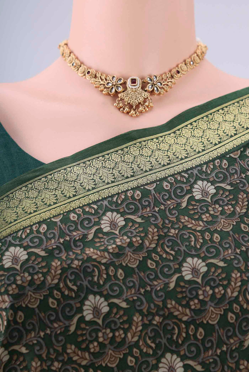 Border image of Bottle Green Printed Silk Saree with Printed design on the body and Zari Border. 