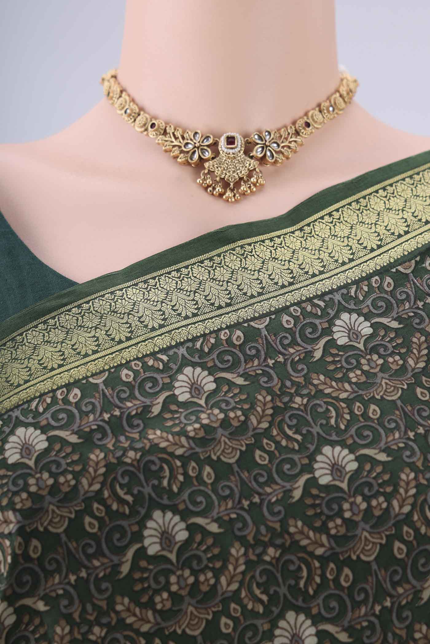 Border image of Bottle Green Printed Silk Saree with Printed design on the body and Zari Border. 