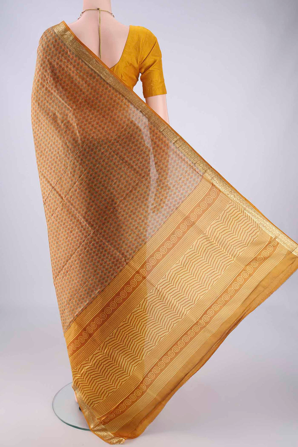 Flat view of Dark Beige Printed Silk Saree with Printed design on the body and Zari Border. 