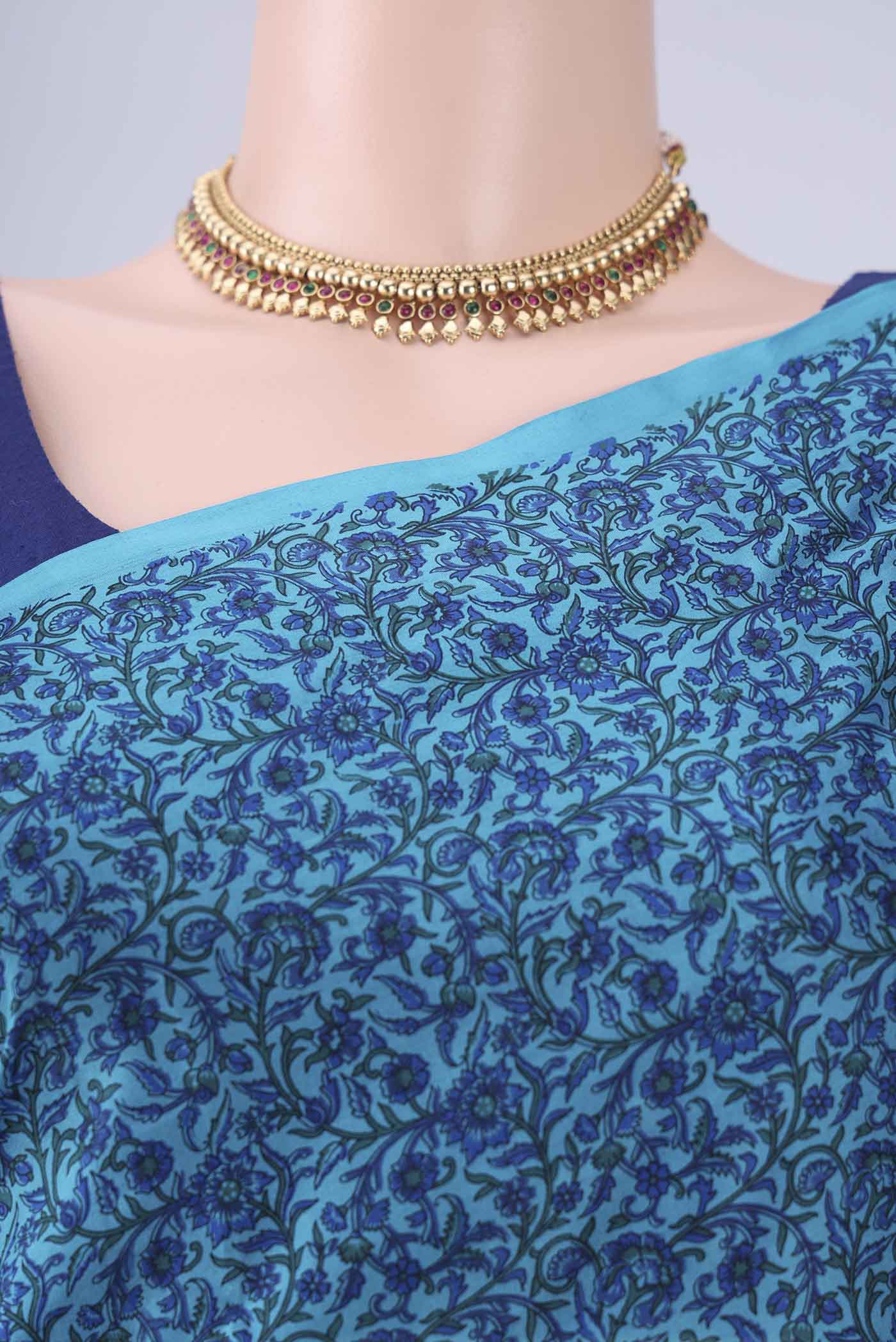 Border image of Blue Printed Silk Saree with Printed design on the body and Plain Border. 