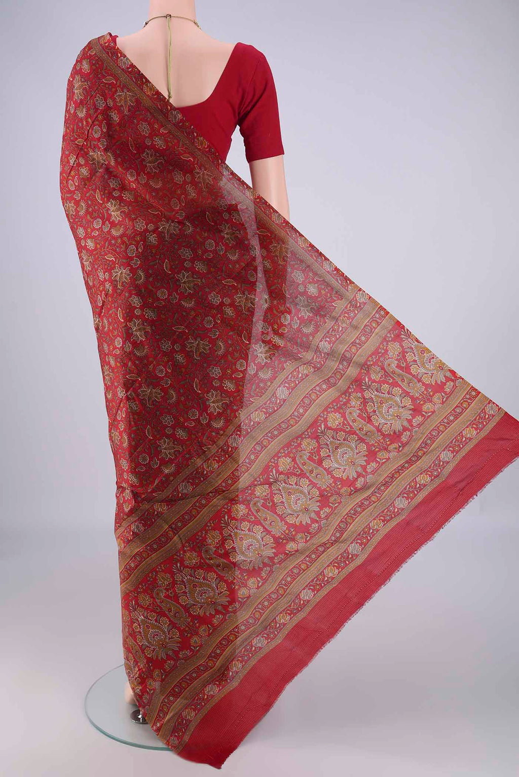 Flat view of Maroon Printed Silk Saree with Printed design on the body and Zari Border. 