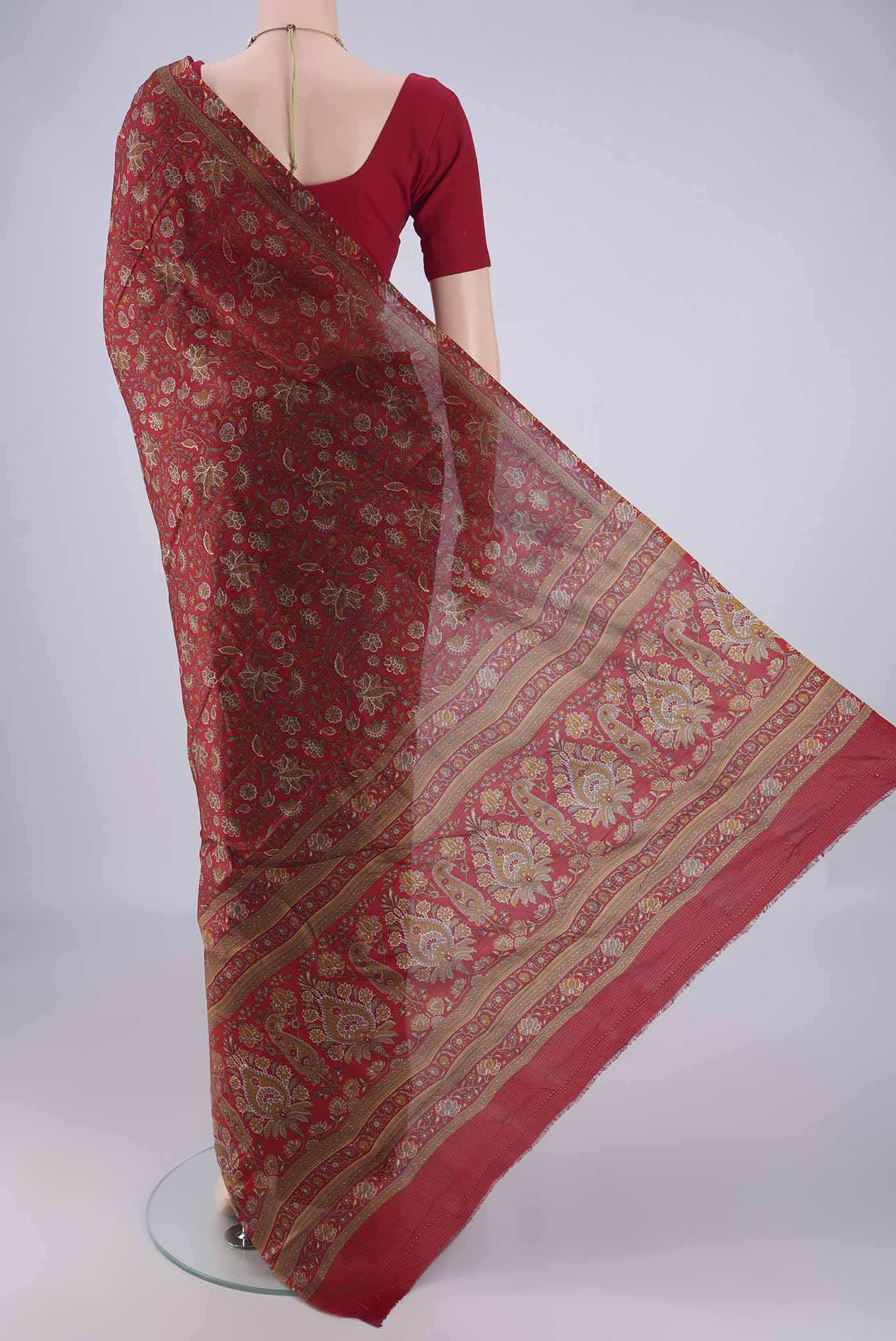 Flat view of Maroon Printed Silk Saree with Printed design on the body and Zari Border. 