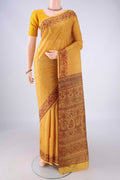 Mustard Printed Silk Saree with Printed design on the body and Printed Border.  displayed on a mannequin