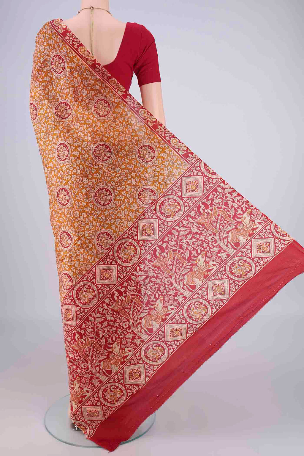 Flat view of Rust Printed Silk Saree with Printed design on the body and Zari Border. 