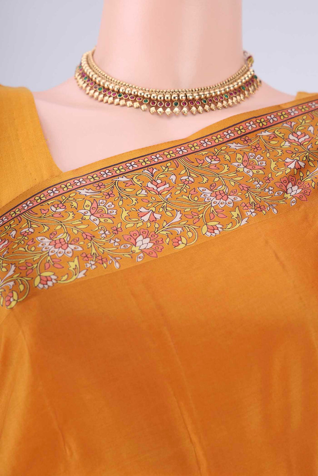 Border image of Mustard Printed Silk Saree with Plain Body and Printed Border. 