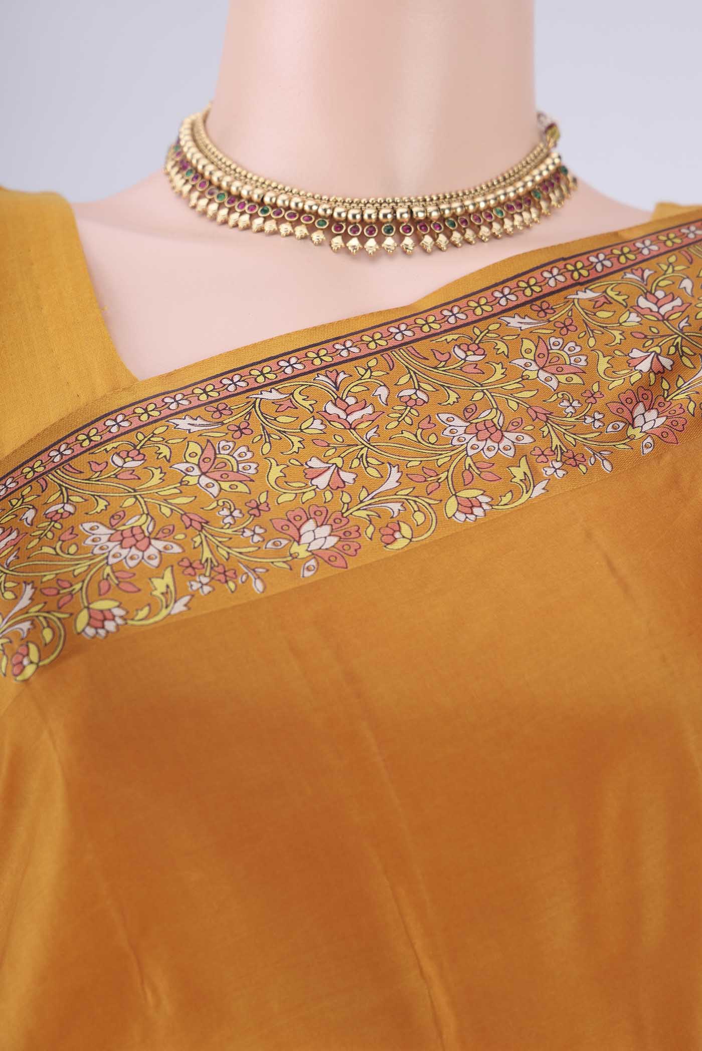 Border image of Mustard Printed Silk Saree with Plain Body and Printed Border. 