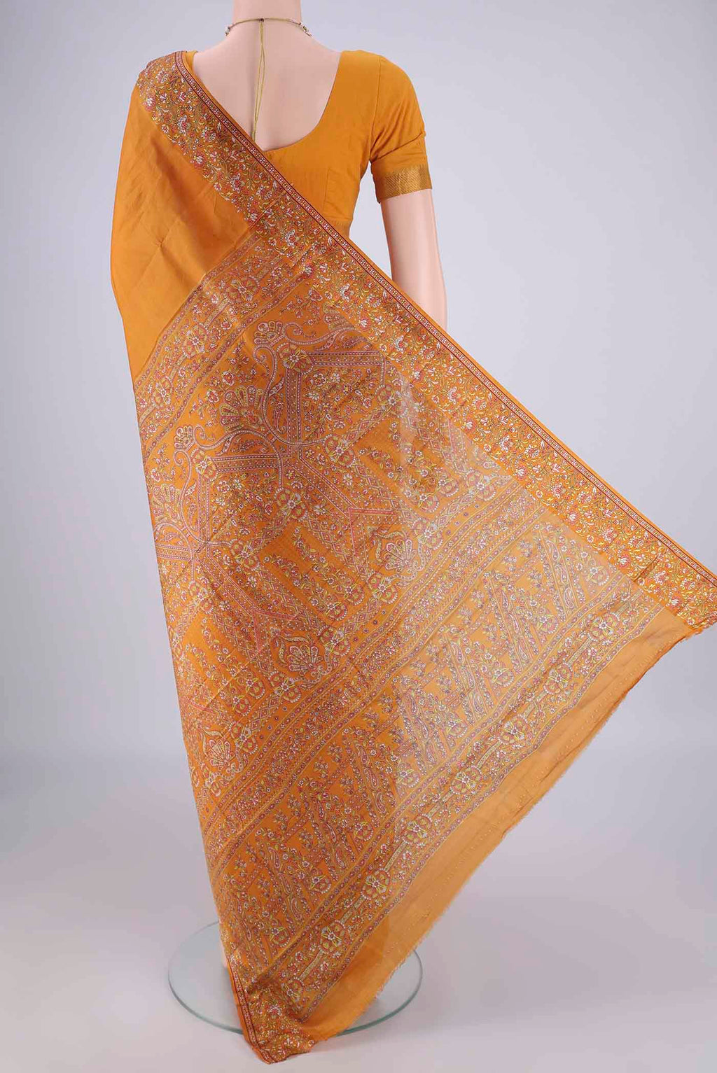 Flat view of Mustard Printed Silk Saree with Plain Body and Printed Border. 