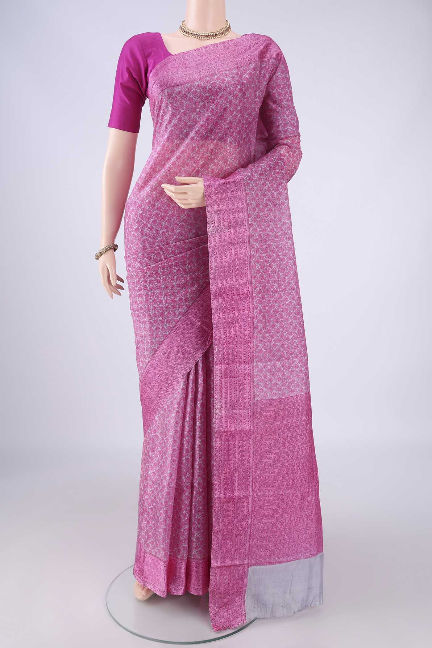 Pink Printed Silk Saree with Printed design on the body and Printed Border.  displayed on a mannequin