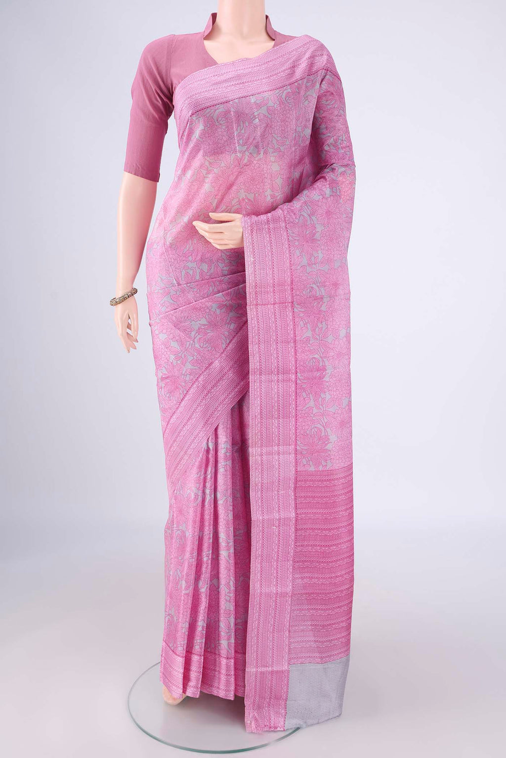 Grey Printed Silk Saree with Printed design on the body and Printed Border.  displayed on a mannequin
