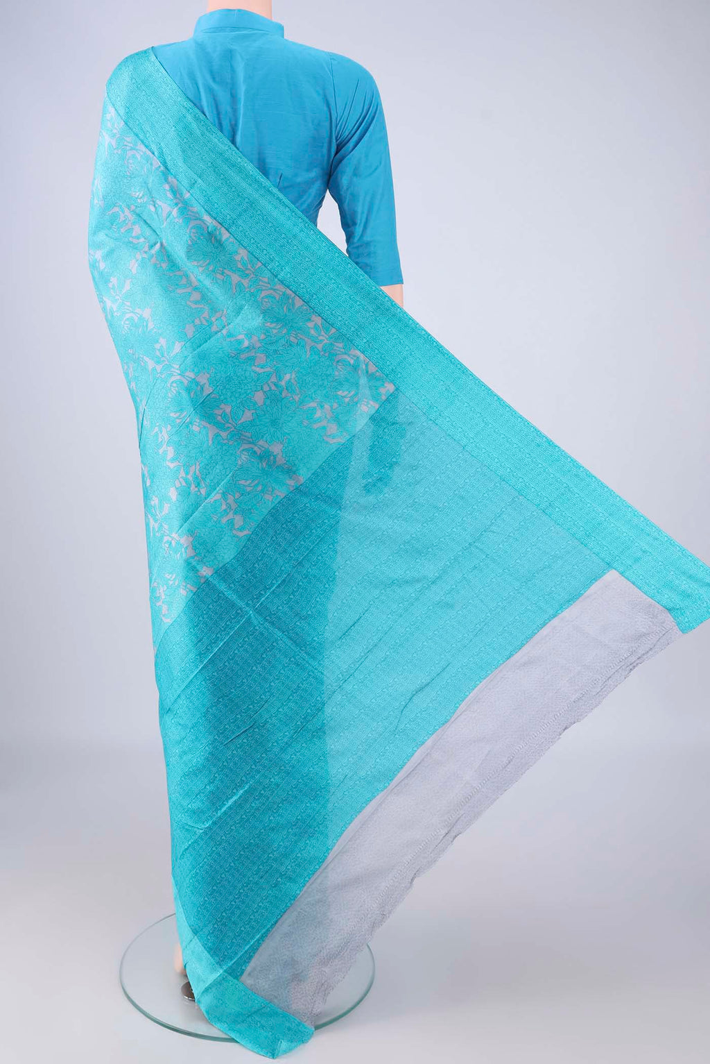Flat view of Grey Printed Silk Saree with Printed design on the body and Printed Border. 
