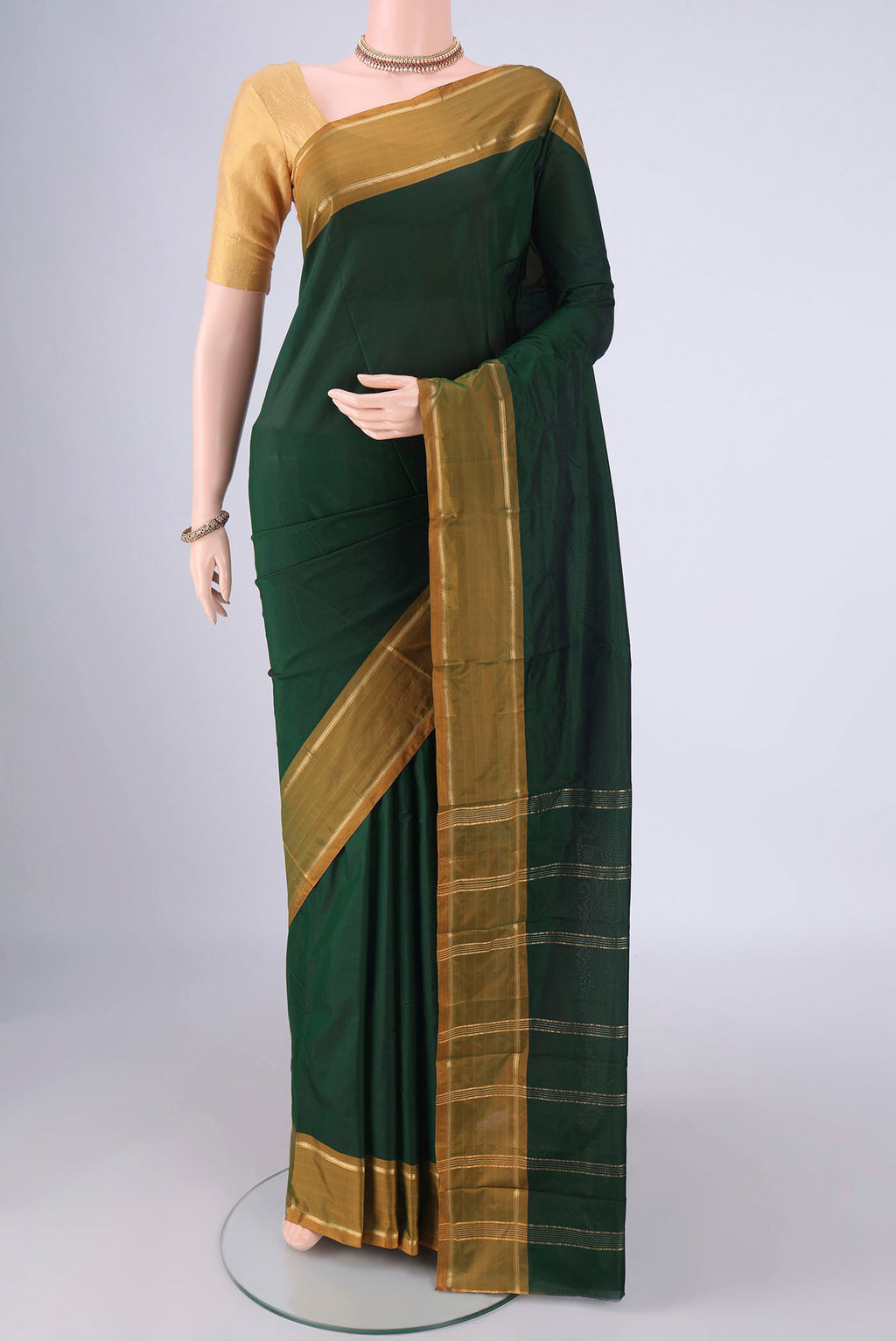 Bottle Green Blended Bangalore Silk Saree with Plain Body and Plain Border.  displayed on a mannequin