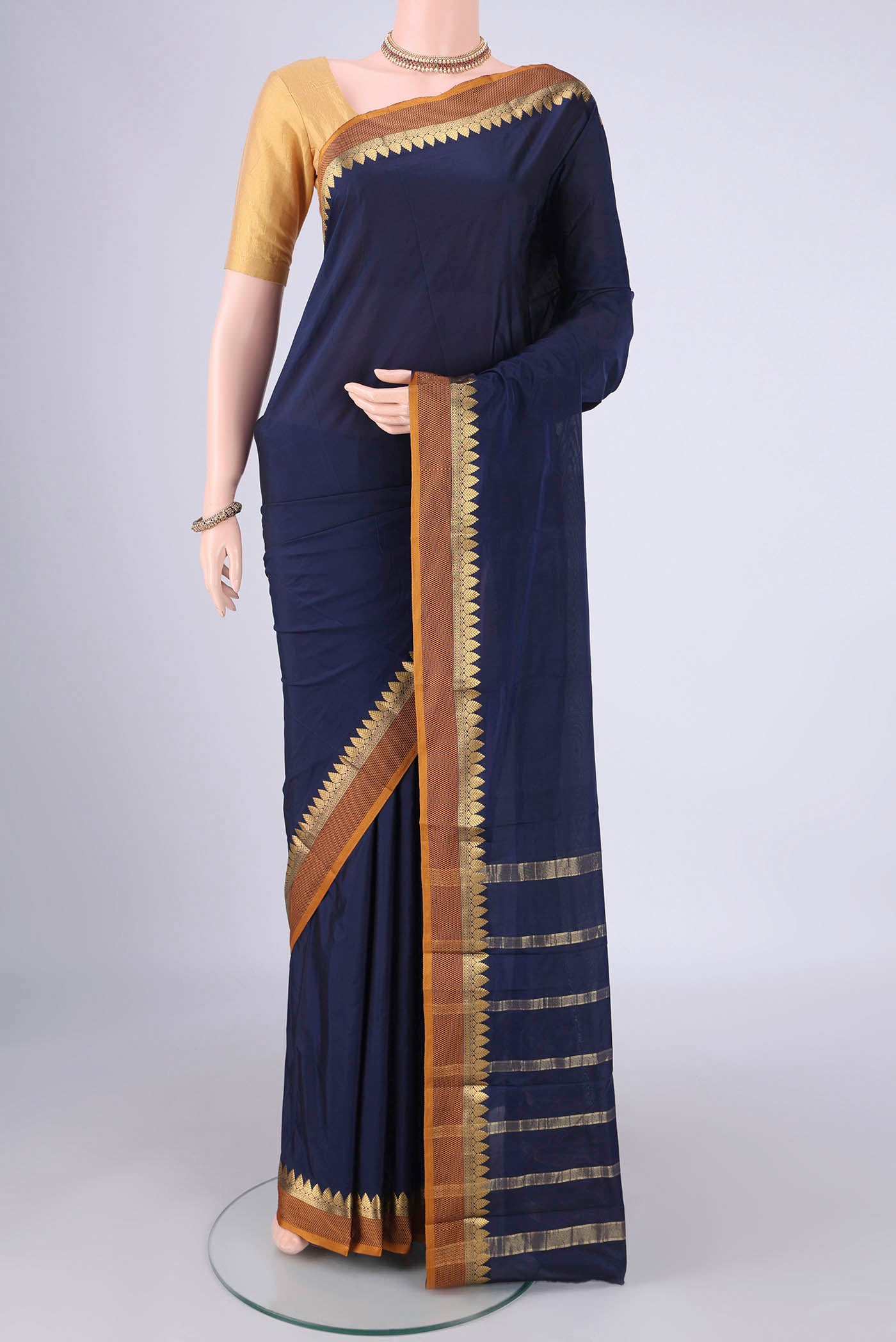 Navy Blue Blended Bangalore Silk Saree with Plain Body and Plain Border.  displayed on a mannequin