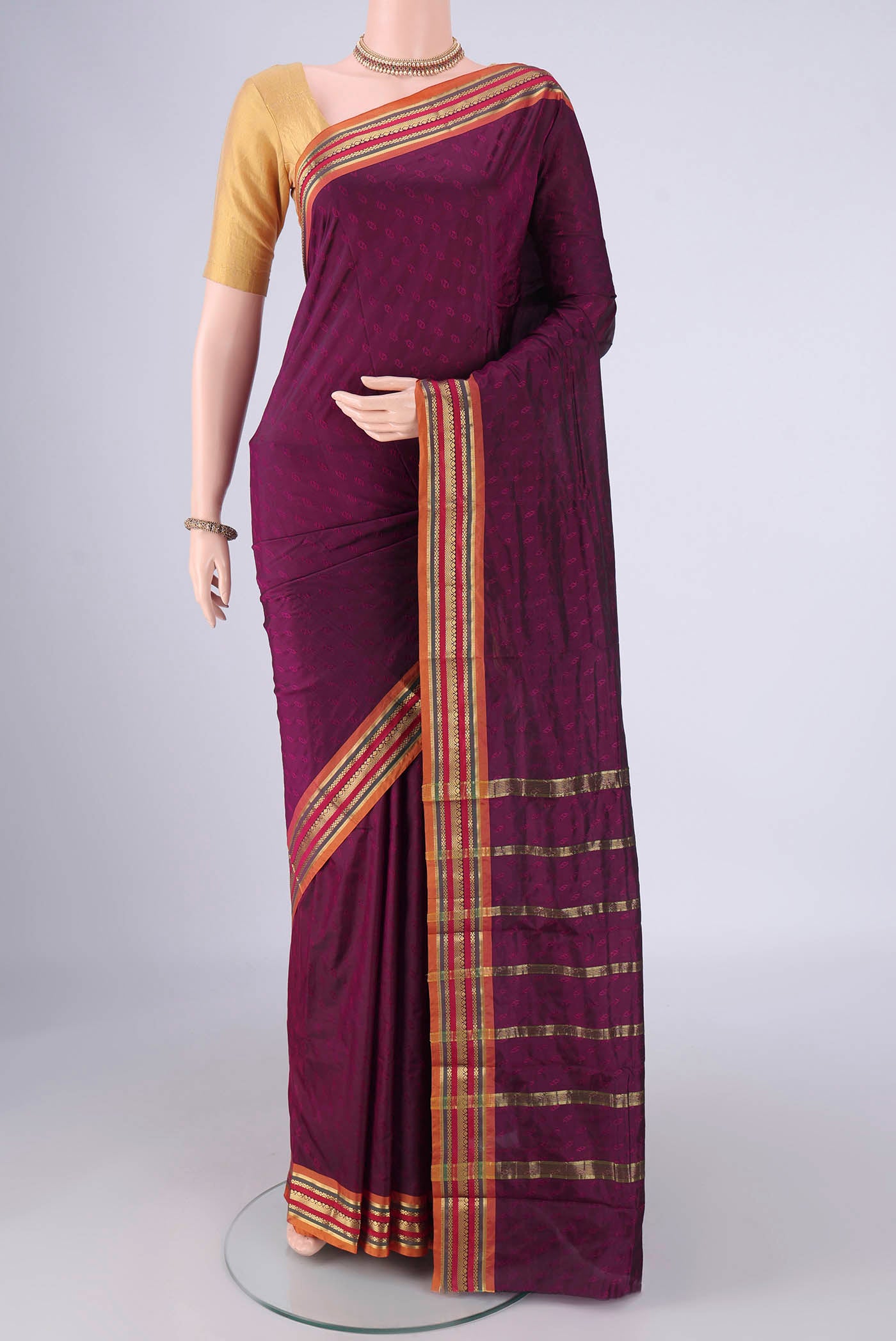 Burgundy Blended Bangalore Silk Saree with Jacquard design on the body and Plain Border.  displayed on a mannequin