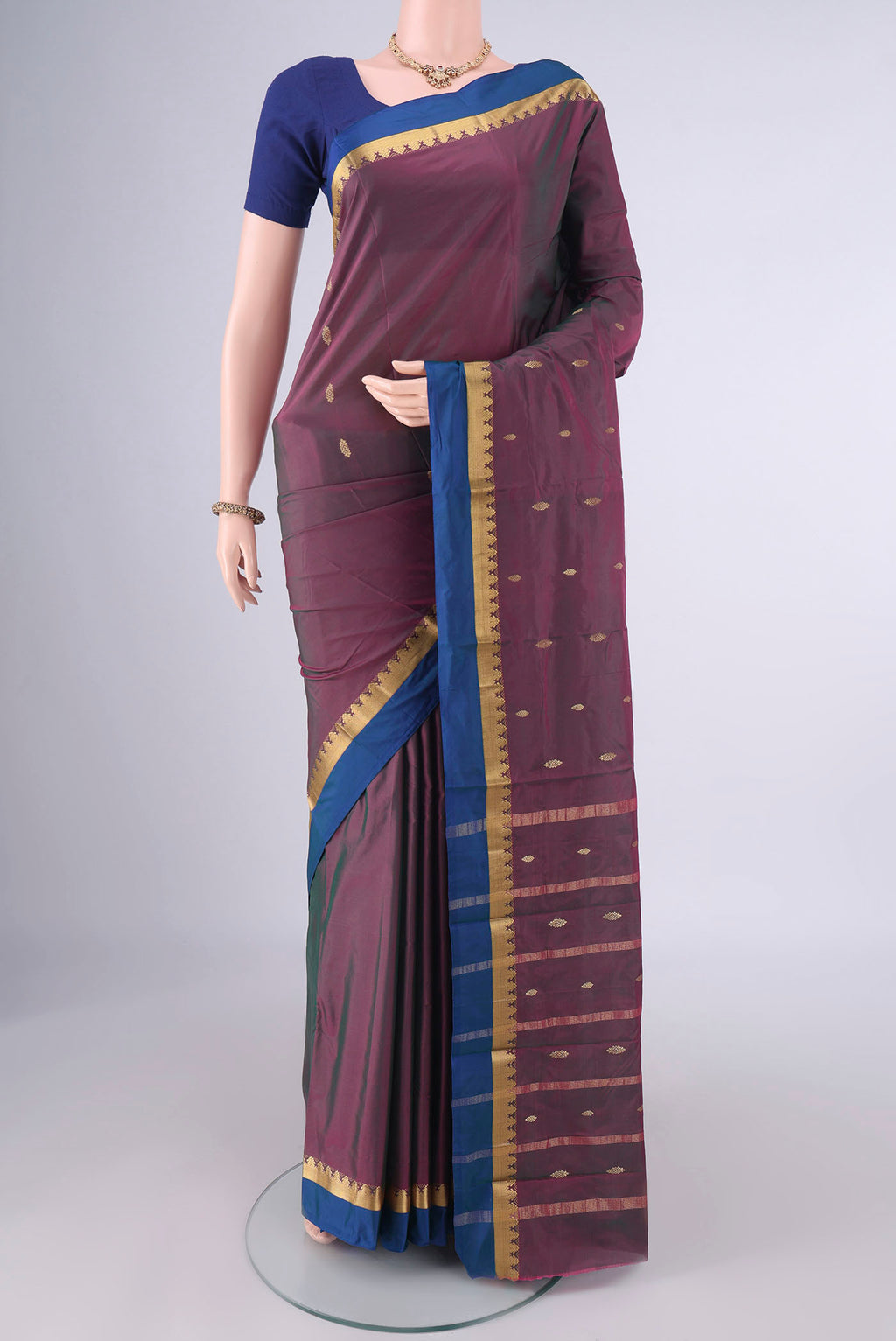 Magenta with Green Color Blended Bangalore Silk Saree with Zari Butta on the body and Zari Border.  displayed on a mannequin